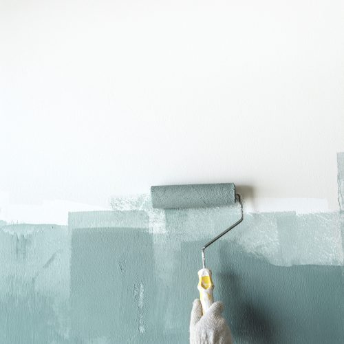 Construction worker painting the wall